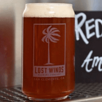 Reddy r not is served in a beer can glass as a lighter red beer from Lost Winds Brewing